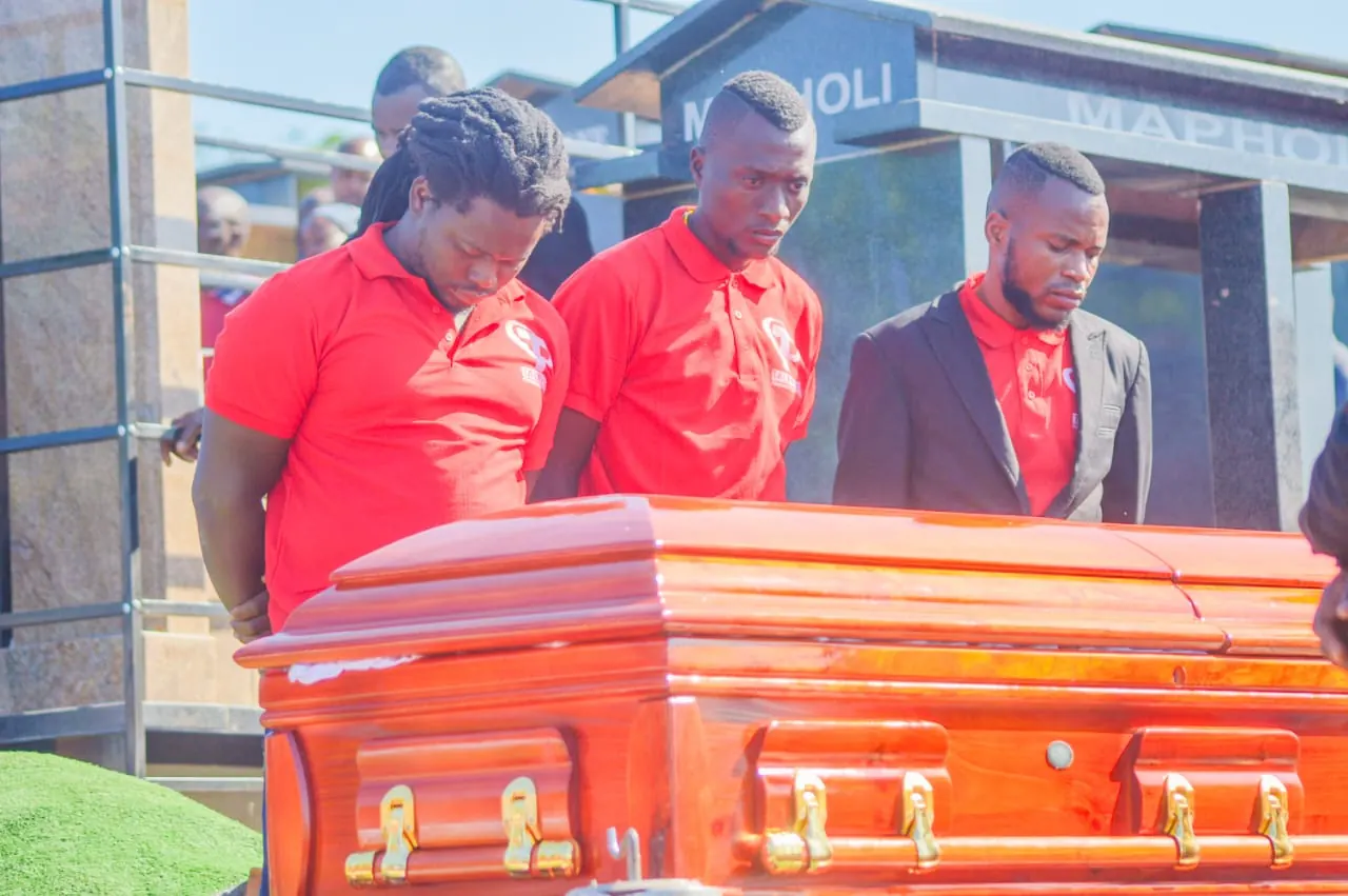 Talifhani team carrying a coffin with care and respect